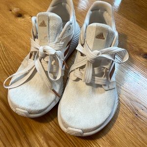 White with gold adidas shoe